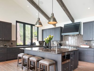 Kitchen island with four stools and two pendant lights above